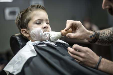 Funny shaving of little boyの写真素材