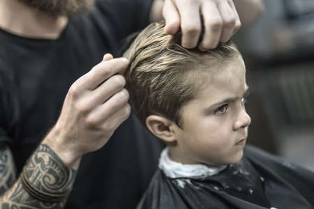 Kids hair styling in barbershopの写真素材