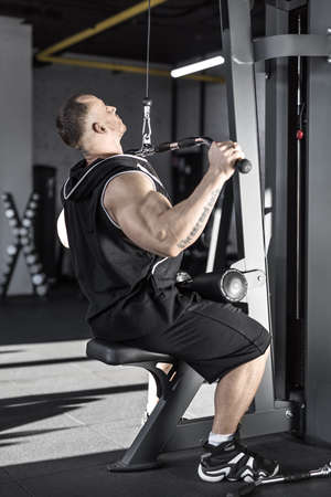 Strong mans workout in gymの写真素材