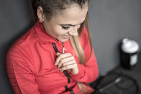 Sportive girl relaxing in gymの写真素材