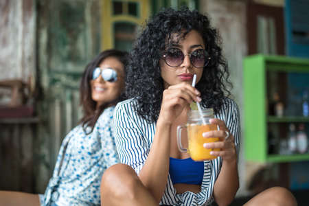 Girls with cocktailsの写真素材