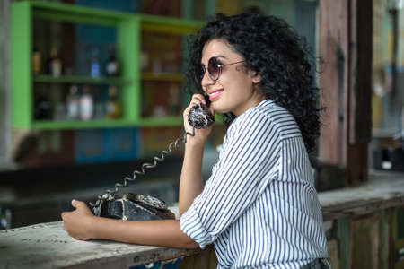 Girl is talking on phoneの写真素材