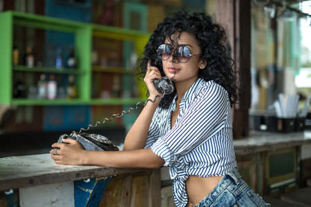 Girl is talking on phoneの写真素材