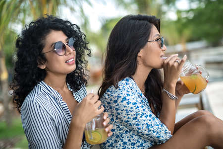 Girls relaxing with cocktailsの写真素材