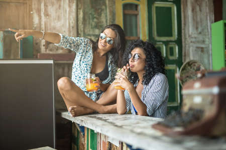 Asian girls in barの写真素材