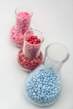 Glass flasks with pillsの写真素材