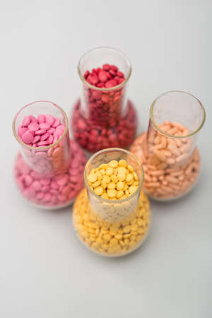 Glass flasks with pillsの写真素材