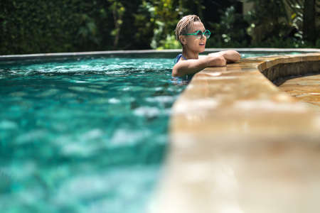 Blonde girl in poolの写真素材