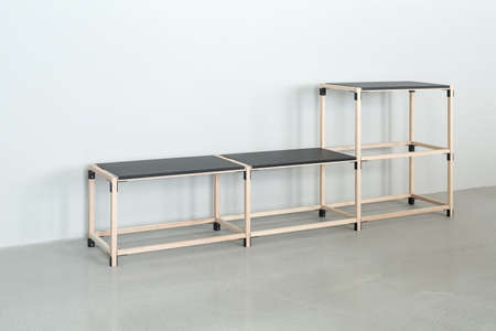 Wooden construct with black tabletopsの写真素材