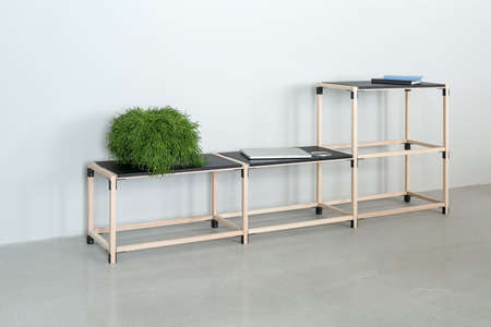 Wooden construct with black tabletopsの写真素材