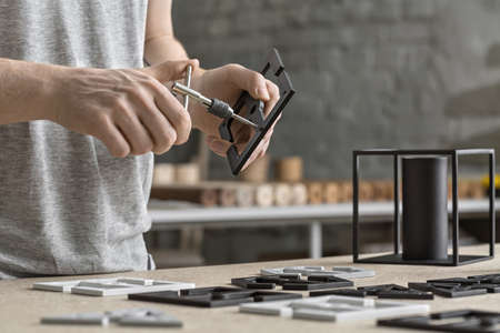 Man using wrench in workshopの写真素材
