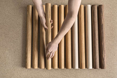 Man taking wooden billetの写真素材