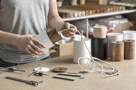 Assembling of lamp in workshopの写真素材