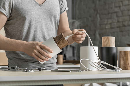 Assembling of lamp in workshopの写真素材