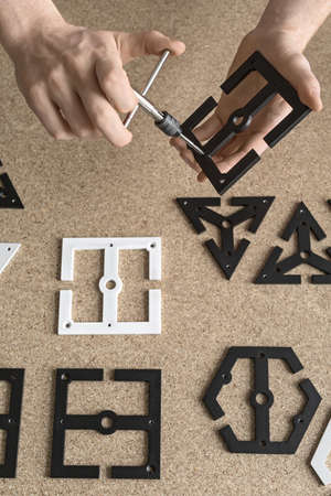 Man using wrench on billet