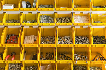 Plastic yellow boxes with instruments on wallの写真素材