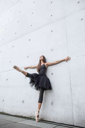 Attractive ballerina posing outdoorsの写真素材