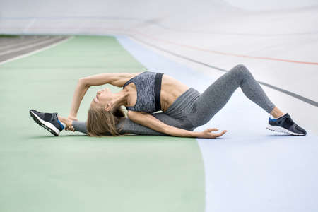 Sportive girl training outdoors