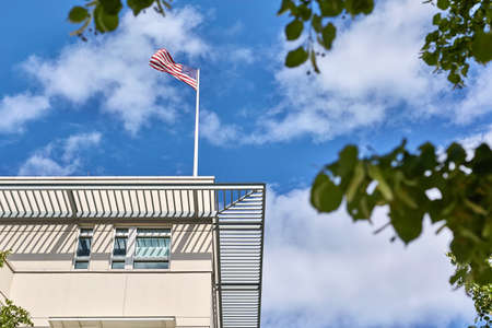 USA flag on roof of embassyの写真素材