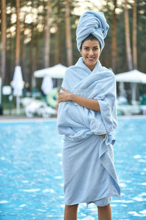 Model near swimming pool outdoorsの写真素材
