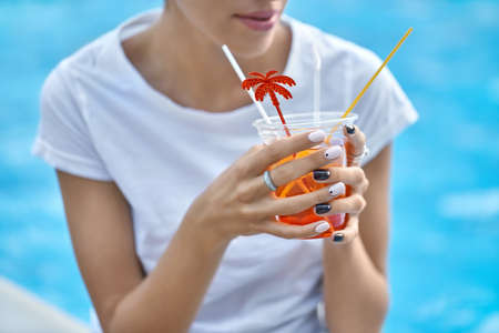 Model with orange cocktailの写真素材