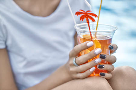 Model with orange cocktailの写真素材