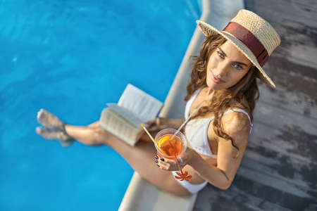 Model near swimming pool outdoorsの写真素材