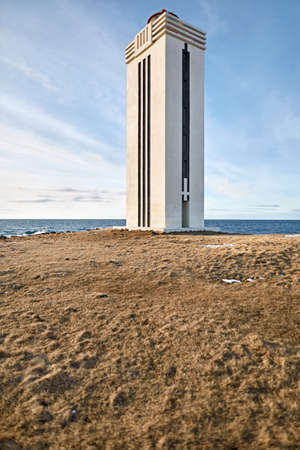 Light lighthouse on promontory