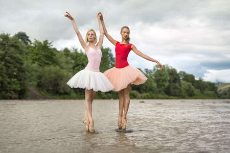 Ballerinas posing in riverの写真素材