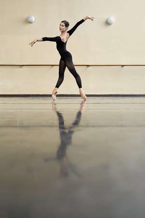 Ballerina posing in dance hallの写真素材