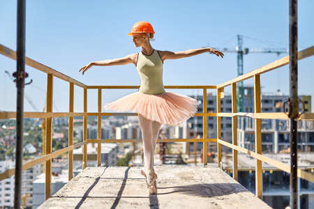 Ballerina posing at concrete balconyの写真素材