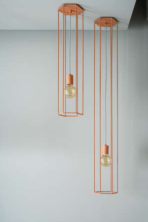 Hanging orange edison lampsの写真素材