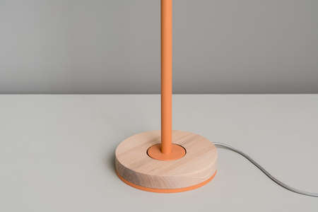 Modern orange lamp with wooden partの写真素材