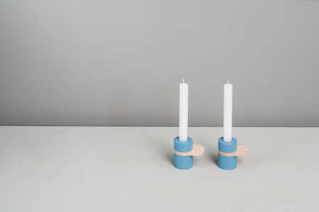 Blue candlesticks with wooden partsの写真素材