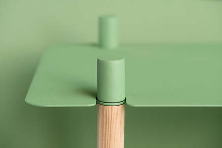 Metal green stand with wooden partの写真素材