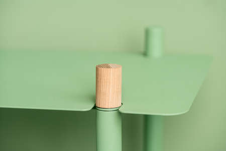 Metal green stand with wooden partの写真素材