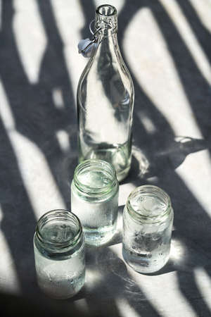 Bottle with glass jarsの写真素材