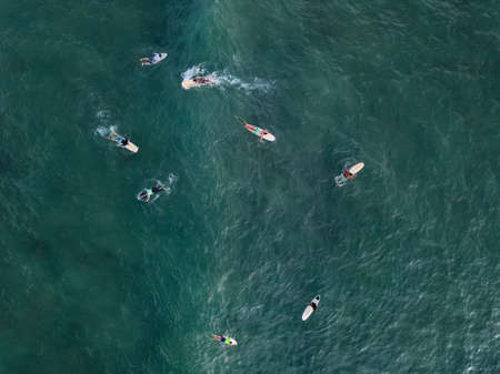 Aerial photo of surfers on boardsの写真素材