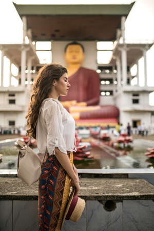 Girl in buddhist templeの写真素材