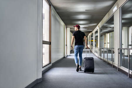 Young guy in airportの写真素材