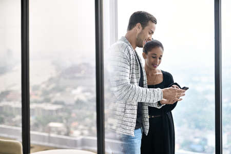 Portrait of lovely interracial couple in their flatの写真素材