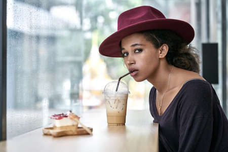 Beautiful girl in cafeの写真素材