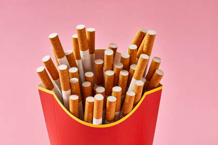 Many cigarettes in red cartonの写真素材