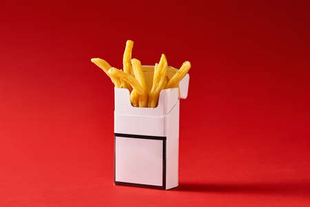 Cigarette pack with friesの写真素材