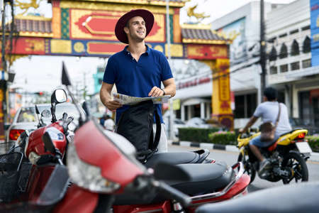 Traveler on asian city street. Daylight shooting.