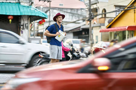 Traveler on asian city street. Daylight shooting.の写真素材