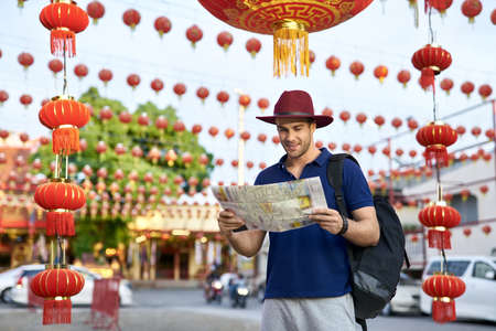 Traveler on asian city street. Daylight shooting.の写真素材