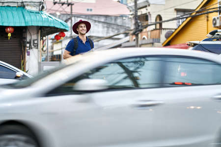 Traveler on asian city street. Daylight shooting.の写真素材