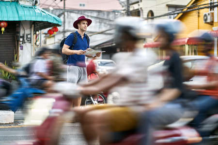 Traveler on asian city street. Daylight shooting.の写真素材