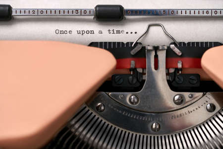 Vintage typewriter coral color in studio, close up.の写真素材